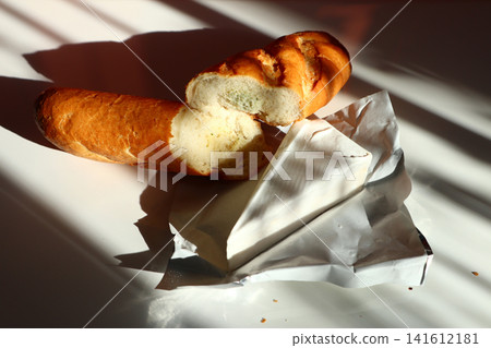 Baguette with garlic and cheese brie. Baguette with garlic and cheese brie. 141612181