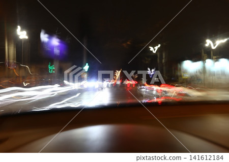 Abstract image of multicolored lights in the city. Abstract image of multicolored lights in the city. 141612184