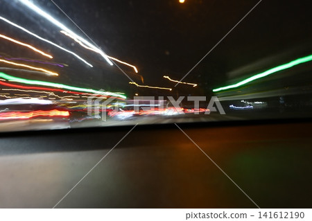 Abstract image of multicolored lights in the city. Abstract image of multicolored lights in the city. 141612190