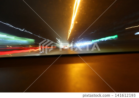 Abstract image of multicolored lights in the city. Abstract image of multicolored lights in the city. 141612193