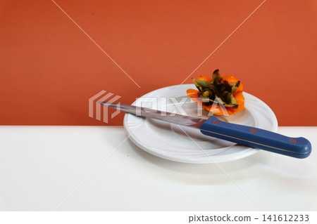Persimmon fruit on two-colored background. Persimmon fruit on two-colored background. 141612233