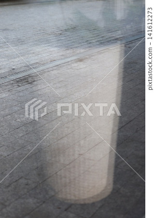 The reflection of the interior on the paving slabs. The reflection of the interior on the paving slabs. 141612273