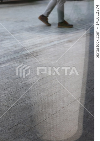 The reflection of the interior on the paving slabs. The reflection of the interior on the paving slabs. 141612274
