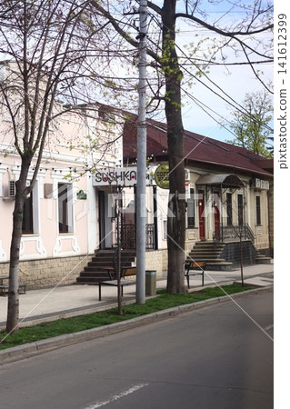 Early spring on intersection of Alexander Pushkin and Alexey Shchusev streets. Republic of Moldova, Chisinau. April 4, 2025. Early spring on intersection of Alexander Pushkin and Alexey Shchusev streets. Republic of Moldova, Chisinau. April 4, 2025. 141612399