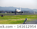 A Boeing 767 passenger plane takes off from Izumo Enmusubi Airport at full power, leaving a trail of heat haze behind it: Izumo City, Shimane Prefecture (Sunny) 141612954