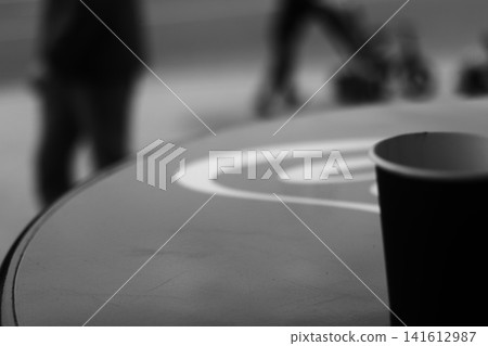 A coffee cup made of kraft paper on the table. A coffee cup made of kraft paper on the table. 141612987