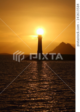Seascape at sunshine. Lighthouse and sailings on the coast. Seaside town of Turgutreis and spectacular sunshine 141613584