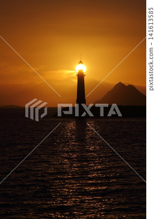 Seascape at sunshine. Lighthouse and sailings on the coast. Seaside town of Turgutreis and spectacular sunshine Seascape at sunshine. Lighthouse and sailings on the coast. Seaside town of Turgutreis and spectacular sunshine 141613585