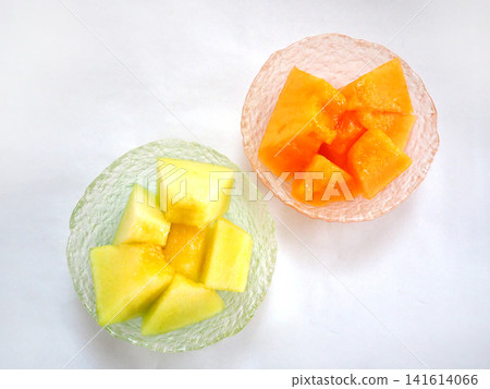 A top-down view of juicy, sliced green and red melon. A top-down view of juicy, sliced green and red melon. 141614066