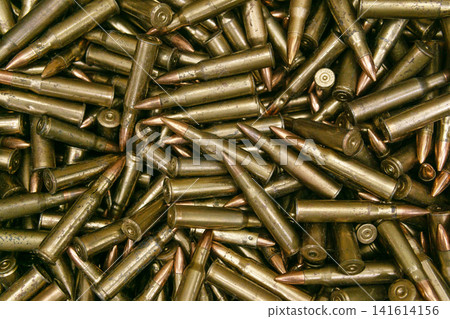bullets background - close up of a group of rifle bullet shells 141614156