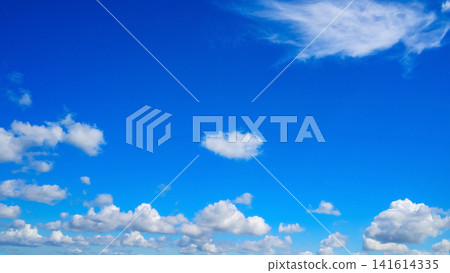 lonely white cloud in the center of a clear blue sky above the lower cloud layer lonely white cloud in the center of a clear blue sky above the lower cloud layer 141614335