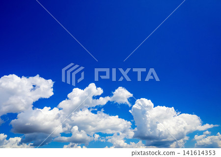 chain of white cumulus clouds along the lower frame border under a blue sky chain of white cumulus clouds along the lower frame border under a blue sky 141614353