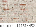 background texture of a distressed white painted red brick wall texture with weathered masonry surface 141614452