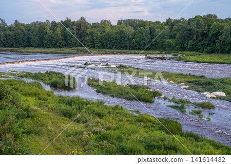 Scenic View of the Venta River and Europe's Widest Waterfall in Kuldiga Latvia at Summer Evening Light Scenic View of the Venta River and Europe's Widest Waterfall in Kuldiga Latvia at Summer Evening Light 141614482