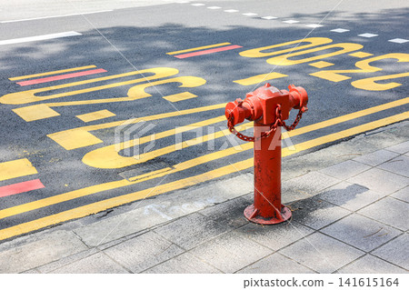 Old red fire hydrant vintage style in the city center street. Old red fire hydrant vintage style in the city center street. 141615164