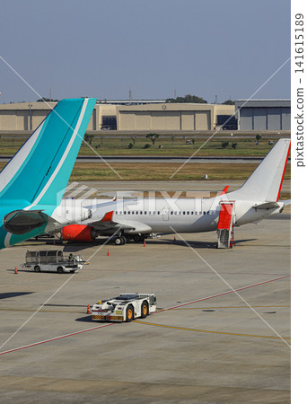 Airplane Tugs, Machine for push back the aircraft to taxiway, one in ground handling services Airplane Tugs, Machine for push back the aircraft to taxiway, one in ground handling services 141615189
