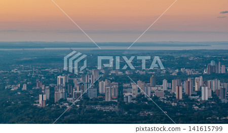 The city of Foz do Iguaçu at dusk and the Itaipu Dam stretching to the horizon. The city of Foz do Iguaçu at dusk and the Itaipu Dam stretching to the horizon. 141615799
