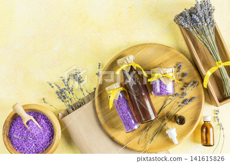 Organic cosmetics with lavender on yellow background, top view Organic cosmetics with lavender on yellow background, top view 141615826
