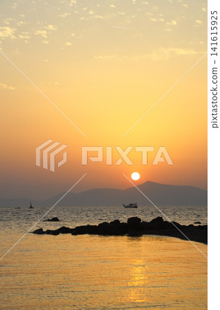 Tourists on holiday in the famous resort town of Bodrum spend time fishing at sunset. Tourists on holiday in the famous resort town of Bodrum spend time fishing at sunset. 141615925