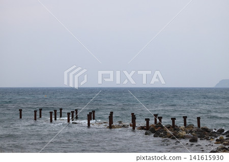 old, rusty abandoned and dismantled pier. sky space is empty. suitable for writing. old, rusty abandoned and dismantled pier. sky space is empty. suitable for writing. 141615930