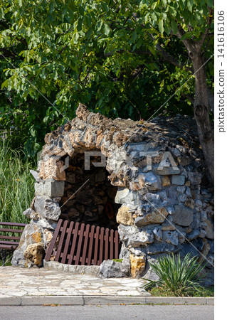 Old cave with stone wall Old cave with stone wall 141616106