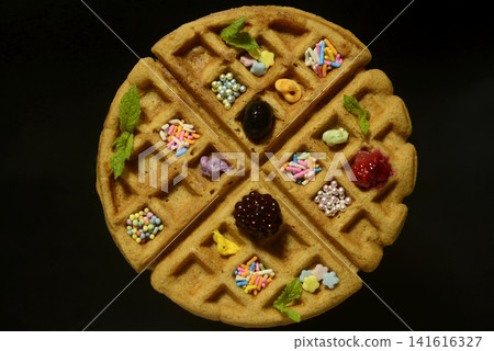 A close-up, overhead view of a waffle. A close-up, overhead view of a waffle. 141616327