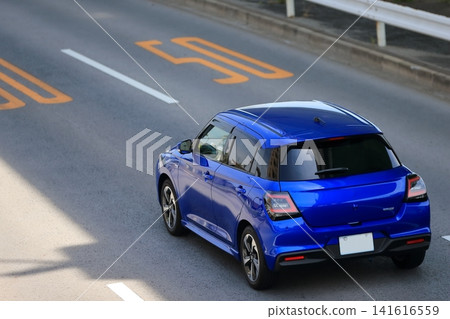 Blue sports compact car Blue sports compact car 141616559