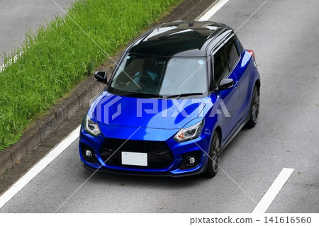 Blue sports compact car Blue sports compact car 141616560