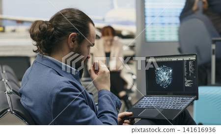 Stressed businessman using AI deep learning systems on laptop in airport lounge, tense work trip for multinational company. Professional working with machine learning algorithms. Stressed businessman using AI deep learning systems on laptop in airport lounge, tense work trip for multinational company. Professional working with machine learning algorithms. 141616936