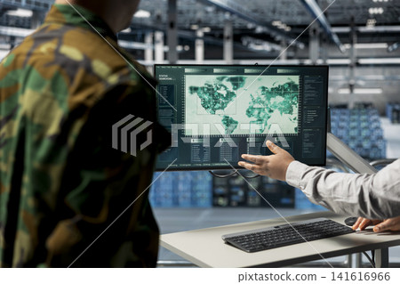 Close up of teamworking military experts in data center pointing to regions of interest on map. Army colleagues in server farm analyzing worldwide threat indicators, coordinating resource allocation Close up of teamworking military experts in data center pointing to regions of interest on map. Army colleagues in server farm analyzing worldwide threat indicators, coordinating resource allocation 141616966