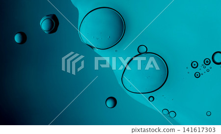 Oil bubbles creating an abstract pattern on a vibrant blue aqueous surface Oil bubbles creating an abstract pattern on a vibrant blue aqueous surface 141617303
