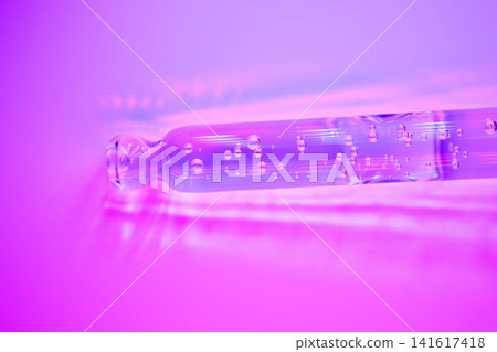 Purple serum in pipette with bubbles for skincare Purple serum in pipette with bubbles for skincare 141617418