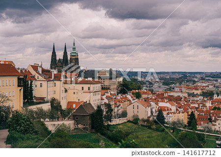 Panoramic view of Prague filmed from the hill near Strahov Monastery. Historic city skyline with red Panoramic view of Prague filmed from the hill near Strahov Monastery. Historic city skyline with red 141617712