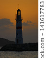 Seascape at sunshine. Lighthouse and sailings on the coast. Seaside town of Turgutreis and spectacular sunshine 141617783