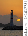 Seascape at sunshine. Lighthouse and sailings on the coast. Seaside town of Turgutreis and spectacular sunshine 141617784