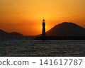 Seascape at sunshine. Lighthouse and sailings on the coast. Seaside town of Turgutreis and spectacular sunshine 141617787