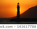 Seascape at sunshine. Lighthouse and sailings on the coast. Seaside town of Turgutreis and spectacular sunshine 141617788