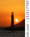 Seascape at sunshine. Lighthouse and sailings on the coast. Seaside town of Turgutreis and spectacular sunshine 141617789