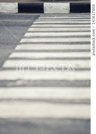Abstract view of a pedestrian crossing with black and white stripes on asphalt 141617808