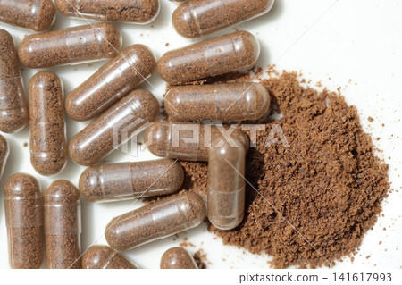 Rice bran powder in transparent capsules; rice bran supplement Rice bran powder in transparent capsules; rice bran supplement 141617993