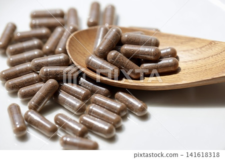 Rice bran powder in transparent capsules; rice bran supplement Rice bran powder in transparent capsules; rice bran supplement 141618318