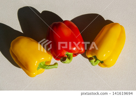 It is a bell pepper placed on a white background. It is a bell pepper placed on a white background. 141619694