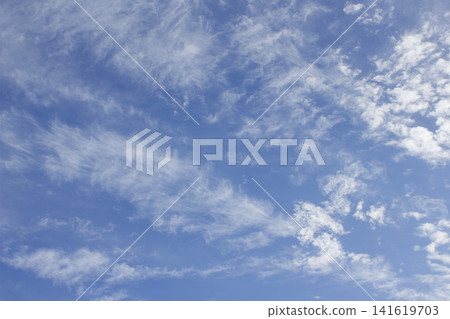 It is a blue sky with cirrocumulus clouds. It is a blue sky with cirrocumulus clouds. 141619703