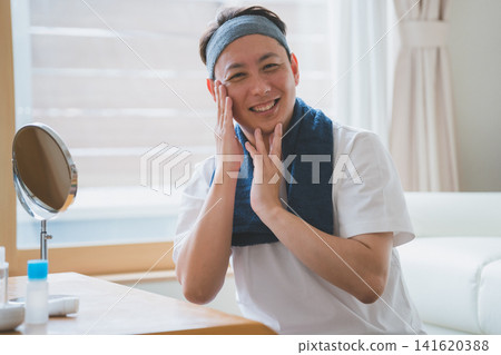 A man in his 40s who does skincare. A man in his 40s who does skincare. 141620388