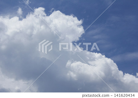 It is a blue sky and white fluffy clouds. It is a blue sky and white fluffy clouds. 141620434