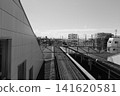 A view of the Tokyo cityscape and railway tracks from the overpass at Higashi-Fushimi Station on the Seibu Shinjuku Line. 141620581