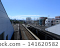 Higashi-Fushimi Station on the Seibu Shinjuku Line in Tokyo: A refreshing summer scene with a clear blue sky and platform roof. 141620582