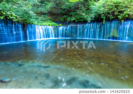 Waterfall flowing through the fresh green Waterfall flowing through the fresh green 141620820
