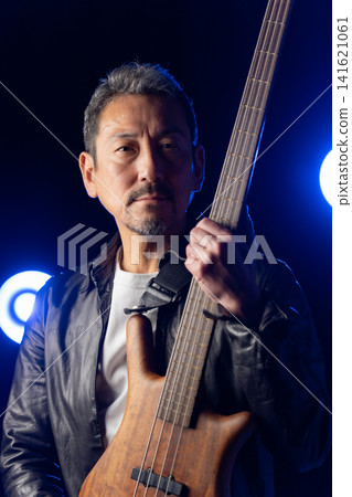 Senior man playing bass Senior man playing bass 141621061