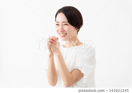 A woman wearing a white blouse - Lifestyle image A woman wearing a white blouse - Lifestyle image 141621145
